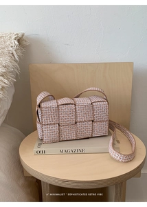 Close-up of woven brown and white square crossbody bag with FF monogram pattern texture