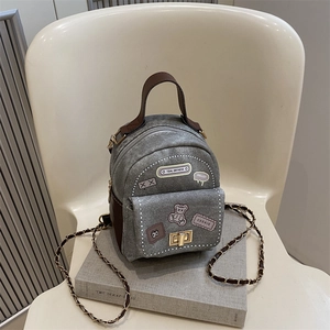 Mini grey denim backpack with brown leather handle and cute cartoon bear patches