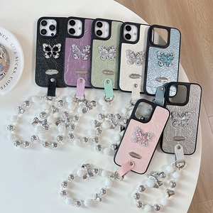 Luxury rhinestone butterfly leather phone cases in multiple colors with beaded wrist straps