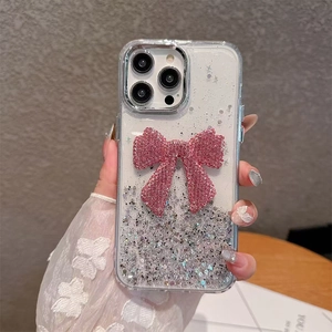 Detail of pink crystal butterfly on glitter transparent case for iPhone 16