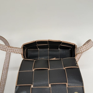 Detailed top view of the woven leather interior and FF logo pattern shoulder strap