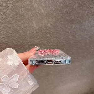 Detail of glitter case showing precise cutouts for charging port and speakers