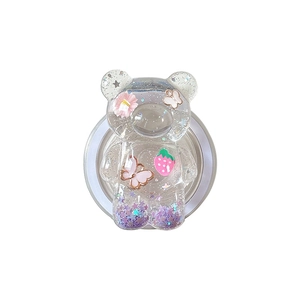 Sparkly bear shaped phone grip with pink flowers and star glitter on white background