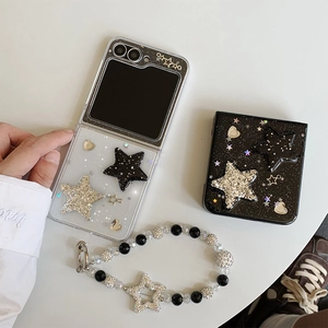 Detail of glitter star charms and beaded lanyard for transparent folding phone case