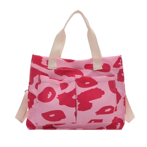 Grand sac cabas en toile rose à imprimé léopard rouge avec deux poches frontales