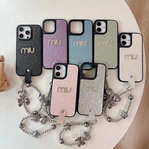 Luxe quilted leather phone case for iPhone 16 with rhinestones and a star charm chain