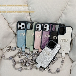 Leather iPhone 16 case with rhinestone logo and star charm chain strap in soft pastel colors