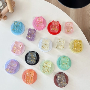 Cute bear phone socket with glitter sequins and gold stars in various vibrant colors