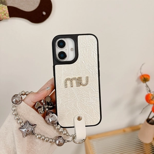Close-up of cream leather iPhone case with rhinestone logo and beaded star star charm