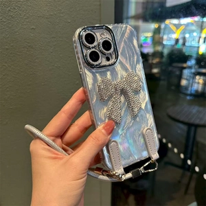 Detail of silver bow and pearl texture case with leather strap for iPhone 17 Pro Max