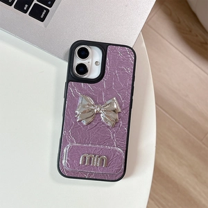 Detail of purple pleated leather case with silver bow and metallic logo for iPhone