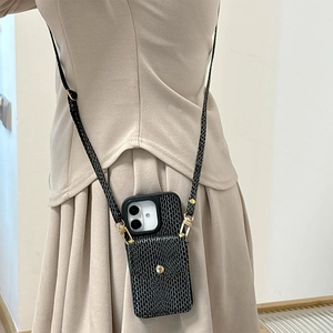 Detail of black snakeskin pattern leather phone case with card slot and crossbody strap