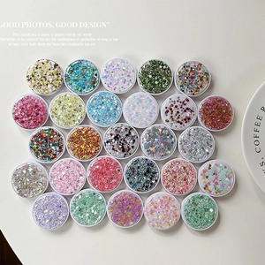 Set of 24 colorful glitter sequins in round jars for phone stands or nail art decoration