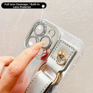 Detail of silver phone case with built-in camera protector and leather wrist strap