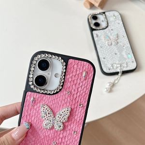 Detail of luxury rhinestone butterfly phone case with pearl tassel and grid leather