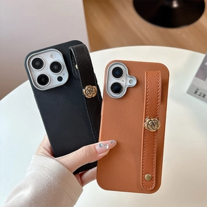 Lychee texture leather iPhone case with metal camellia wrist strap in black and brown