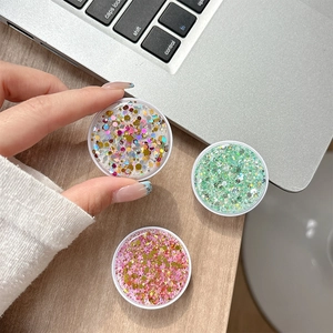 Sparkling round glitter phone socket stand available in gold, mint green and pink colors