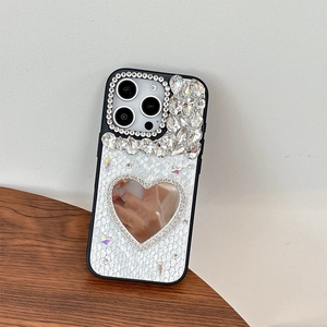 Detail of luxury snake skin iPhone case with heart diamond mirror and crystals