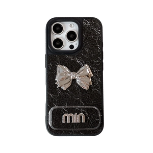 Black wrinkled leather case for iPhone with silver metal bow and built-in kickstand