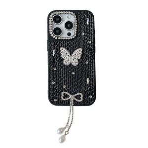 Luxe iPhone case with black crocodile texture, rhinestone butterfly, and pearl tassel