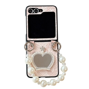 Pink faux leather Samsung Z Flip case with rhinestone crown heart mirror and pearl handle