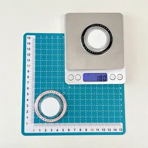 Macro detail of MagSafe phone sockets showing 18.0g weight on a digital scale