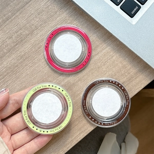 Minimalist MagSafe magnetic phone socket grip with 'Gift For You' print on wooden desk