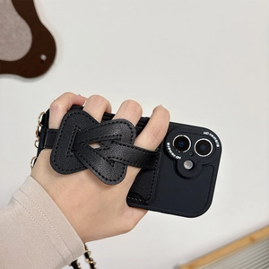 Black iPhone case with leather bow wrist strap and metal crossbody chain for iPhone 16 Pro