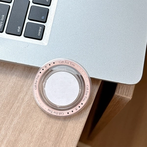 Macro shot of a pink and white magnetic phone grip with Gift For You star pattern