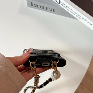 Detail of crossbody phone case with black leather card holder and pearl chain strap