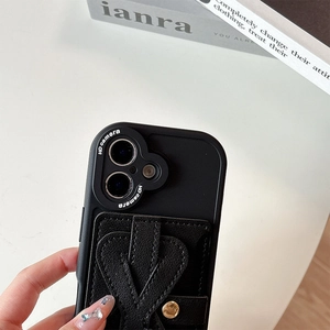 Detail of black leather texture phone case with camera protection and metal buckle strap