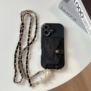 Detail of black leather case with 3D bow card holder and pearl crossbody chain
