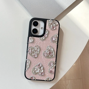 Pink leather phone case featuring sparkling rhinestone heart ornaments for iPhone