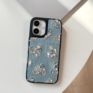 Macro detail of luxury light blue pleated leather iPhone case with sparkling crystal hearts