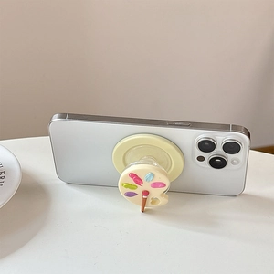Mini palette collapsible phone grip with colorful paint dots and brush on white smartphone