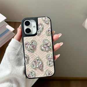 Detail of pink lace phone case with sparkling rhinestone hearts for iPhone 16 Pro