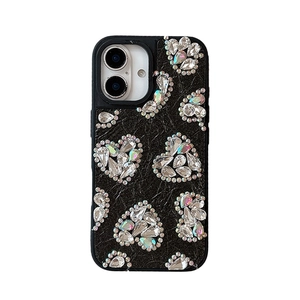 Black leather iPhone case featuring iridescent rhinestone hearts and stud embellishments