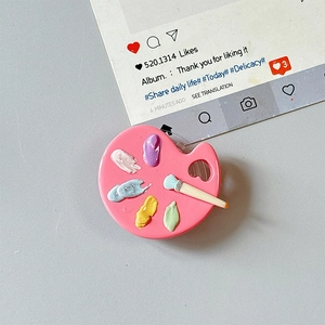 Detail of pink paint palette phone grip with colorful 3D resin pigment and mini brush