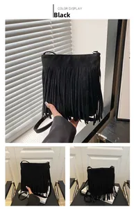 Detail of black suede tassel handbag with long fringes and slim shoulder strap