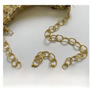 Macro view of gold sequins, durable metallic chain, and premium zipper on the evening bag