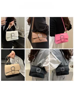 Multiple colors of small square crossbody bags with silver metal buckle on models