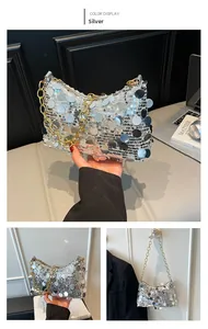 Detailed view of silver sequin crescent bag with metallic gold chain strap for evening
