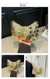 Detail view of large gold sequins on a chain dumpling bag with metallic texture