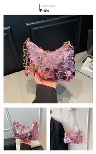 Detailed view of pink sequin crescent bag featuring a chunky gold chain strap