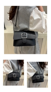 Detail shots of minimalist black leather crossbody bag with silver U-shaped metal buckle