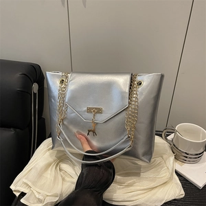 Silver tote bag with metal leather texture, deer pendant and gold chain strap for women