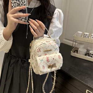Mini-Rucksack in Creme mit Tierprints, goldenen Beschlägen und Tragegriff für Damen