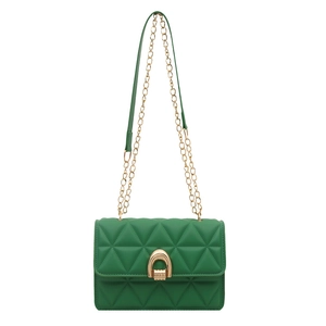 Green geometric quilted shoulder bag with gold horseshoe lock and chain strap on white background