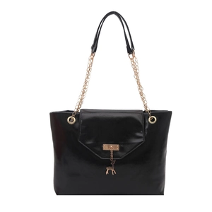Minimalist black glossy leather tote bag with gold chain handles and deer charm