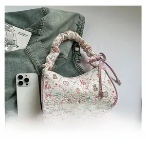 Detailed view of printed bubble cotton handbag with cute bear and pink ribbon patterns